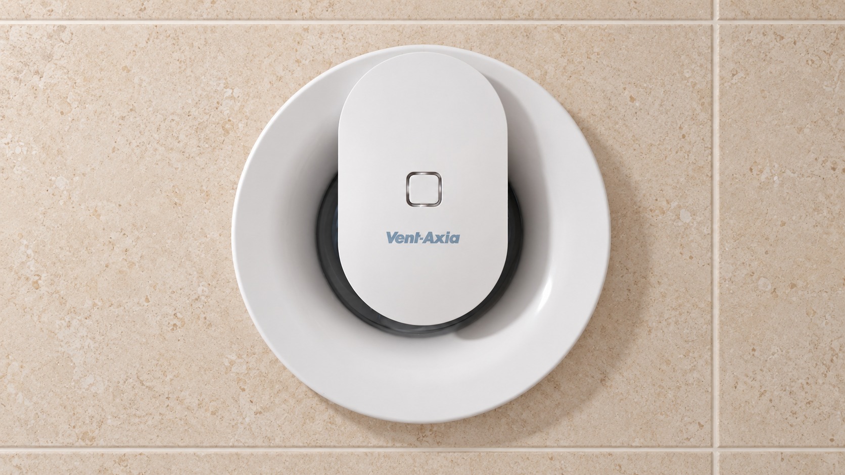 White Vent-Axia extractor fan installed on a tiled bathroom wall